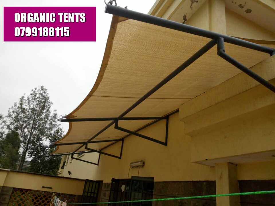 Sand shade sail wall-mounted Kenya by Organic Tents